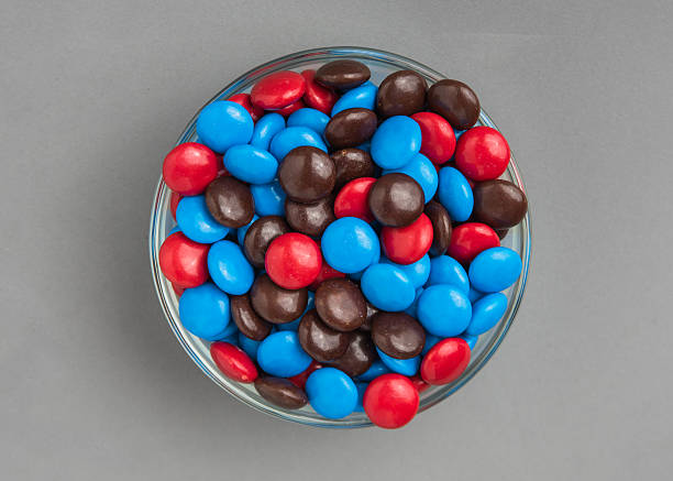istock Red, Brown and Blue Chocolate Candies 589962440