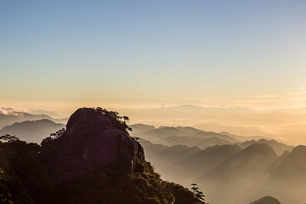 istock Sunrise over san qing mountain China 589962504