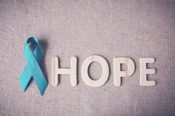 Pink Ribbon with HOPE wooden letters, toning, Breast cancer awar Teal Ribbon with HOPE wooden letters, toning, Ovarian Cancer, cervical Cancer, Kidney Cancer awareness polycystic ovary syndrome photos stock pictures, royalty-free photos & images