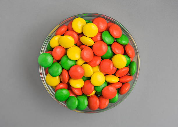 istock Yellow, Orange, and Green Chocolate Candies 589962950