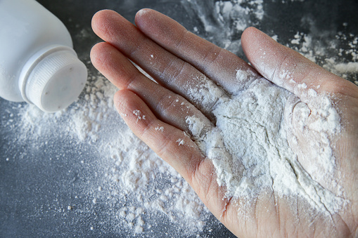 Talcum powder on hands