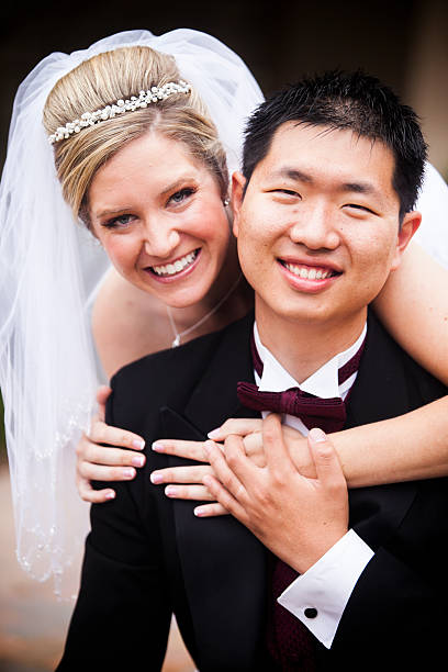 istock Beautiful Bride and Asian Groom 589965378