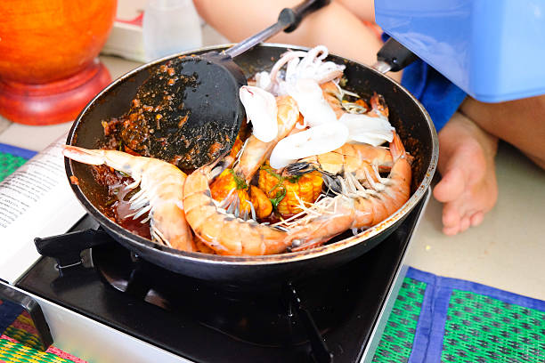 Sight on the seafood cooking with shrimps and squid