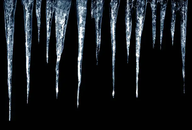Set of icicles and frost on black background