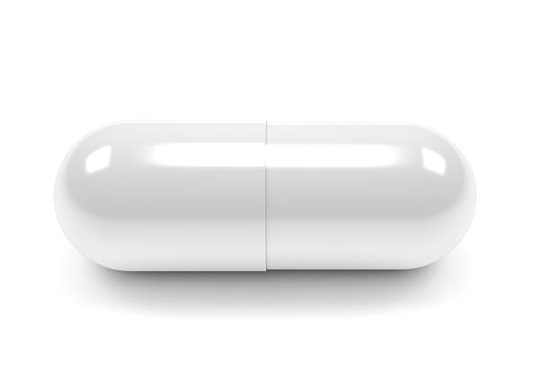 pillole capsule isolati su sfondo bianco - painkiller pill capsule birth control pill foto e immagini stock