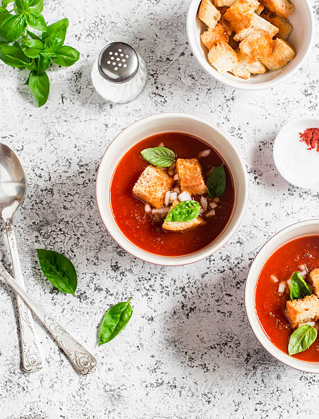 istock Cold tomato soup gazpacho with croutons and Basil 589970170