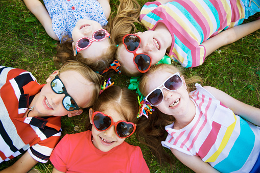 Happy kids in sun-protective eyeglasses