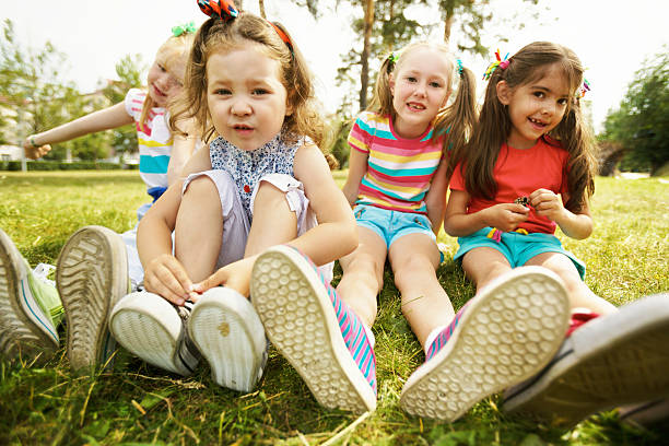 istock Girls on lawn 589973596