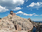 istock Harney Peak Lookout Tower and pumphouse with small dam BlackHills 589974246