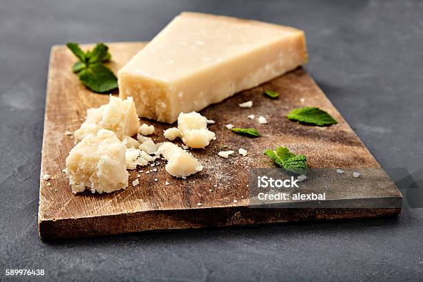 Piece Of A Parmesan And Grated Cheese Stock Photo - Download Image Now - Parmesan Cheese, Cheese, Appetizer