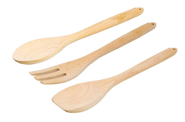 istock Wooden kitchen utensils set, isolated  white background 589979010