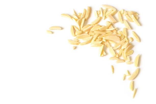 istock Almond chopped on white background - isolated 589980348