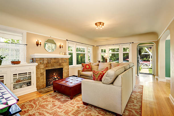 istock Cozy living room interior with brick fireplace and beige couch 589981654