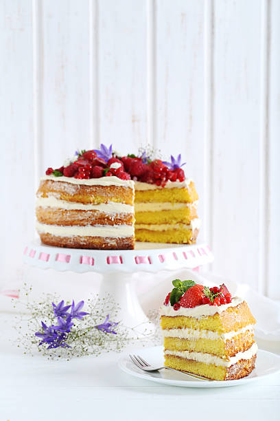 istock Delicious biscuit cake with berries on cake stand 589983298