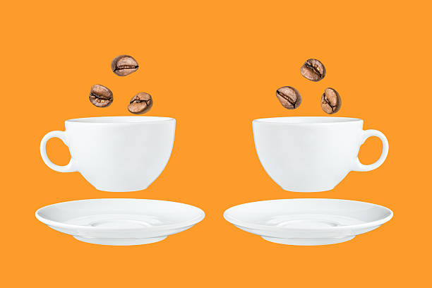 istock Coffee cup and saucer with coffee beans 589983552