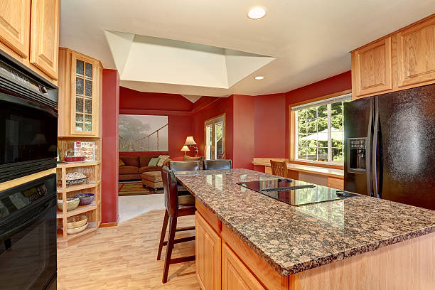 istock Kitchen room interior with red walls, granite counter top 590033386
