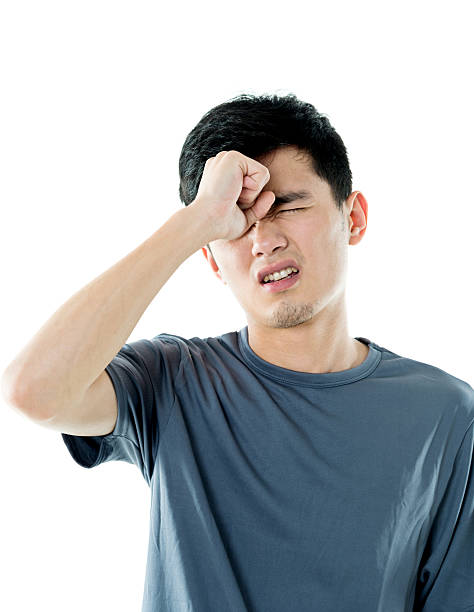 istock Young man headache against white background 590033960