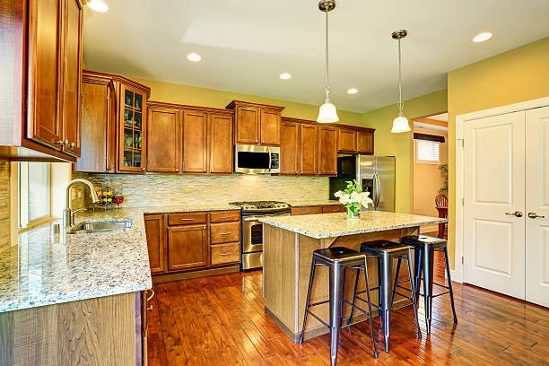 istock Wooden kitchen interior with kitchen island and cabinets. 590035048