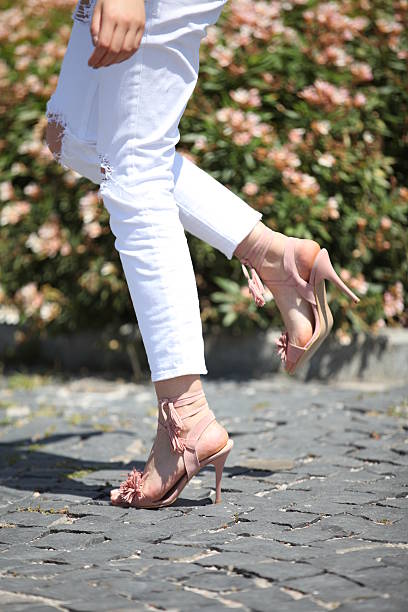 istock woman shoes on nature background 590036554