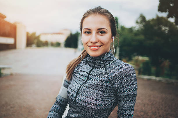 istock Sportswoman with headphones 590037150