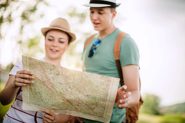 istock Young couple lost in woods 590037590
