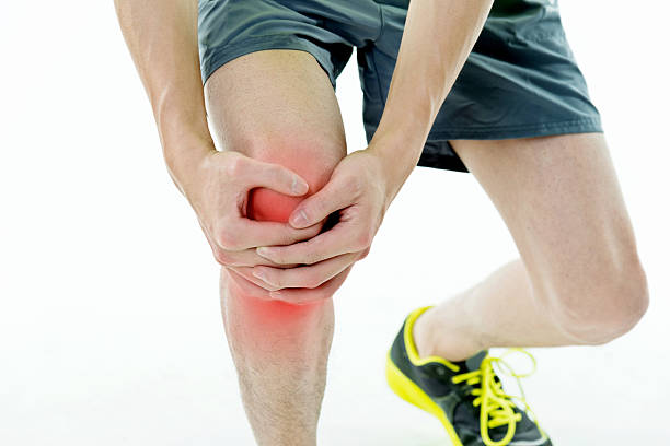istock Man holding his painful knee 590037968