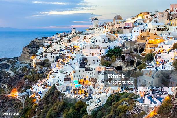 Oia Village At Sunset Santorini Island Greece Stock Photo - Download Image Now - Aegean Sea, Architecture, Backgrounds