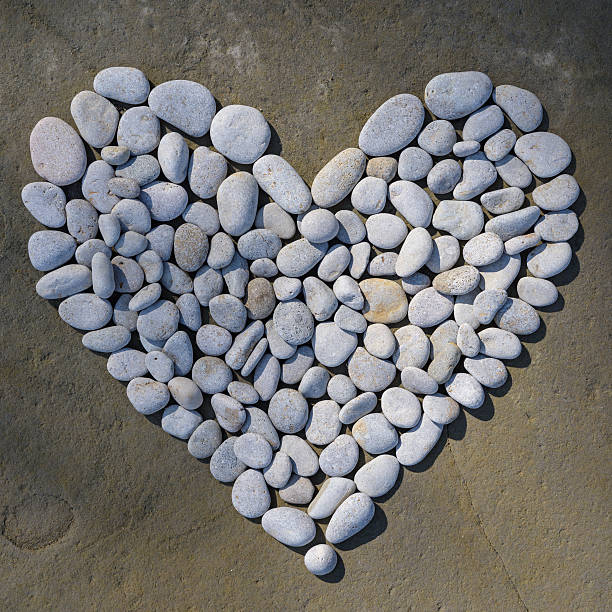 istock Heart of white pebbles 590038602