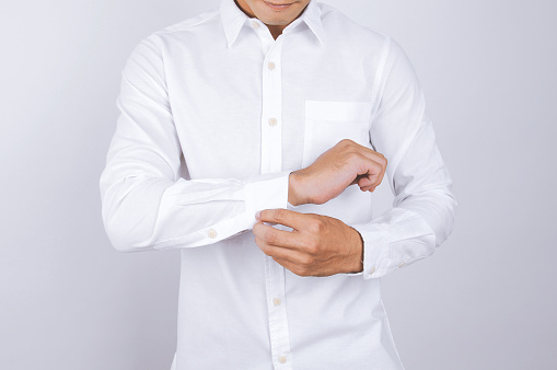 man wearing a white shirt. White background.