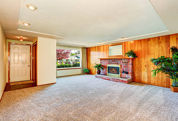istock Empty living  room with wood panel wall and fireplace 590040628