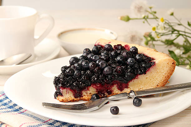 istock Slice of bilberry cake 590040726