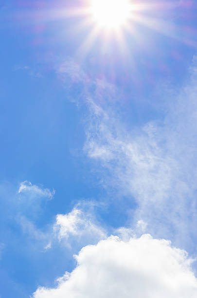 istock Looking up at blue sky with sun beam with cloudy 590041936