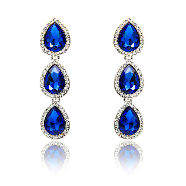 istock Pair of sapphire earrings isolated on white 590042030