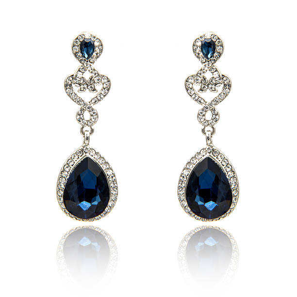 istock Pair of sapphire earrings isolated on white 590042202