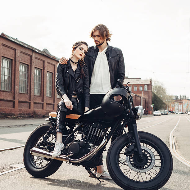 istock Couple in love and vintage custom motorcycle 590042280