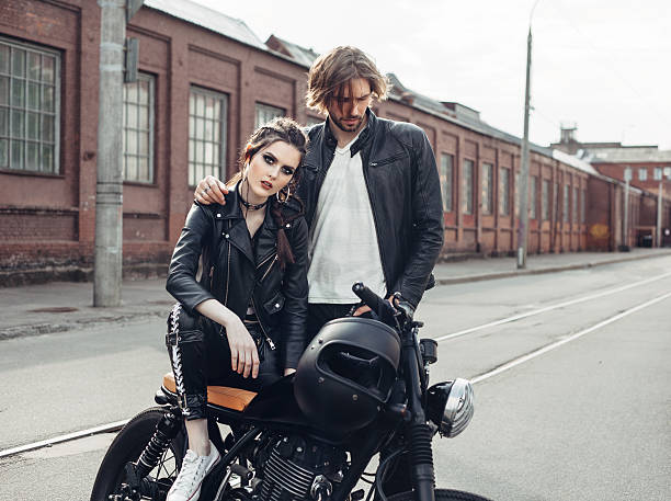 istock Couple in love and vintage custom motorcycle 590042346