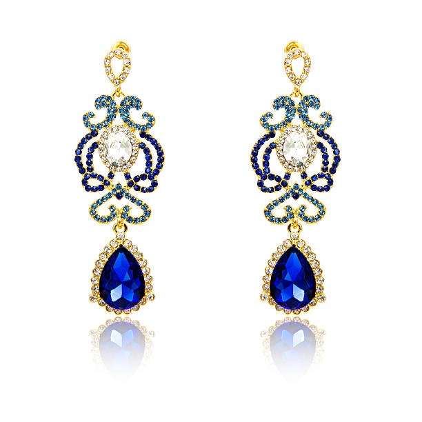istock Pair of sapphire earrings isolated on white 590042348