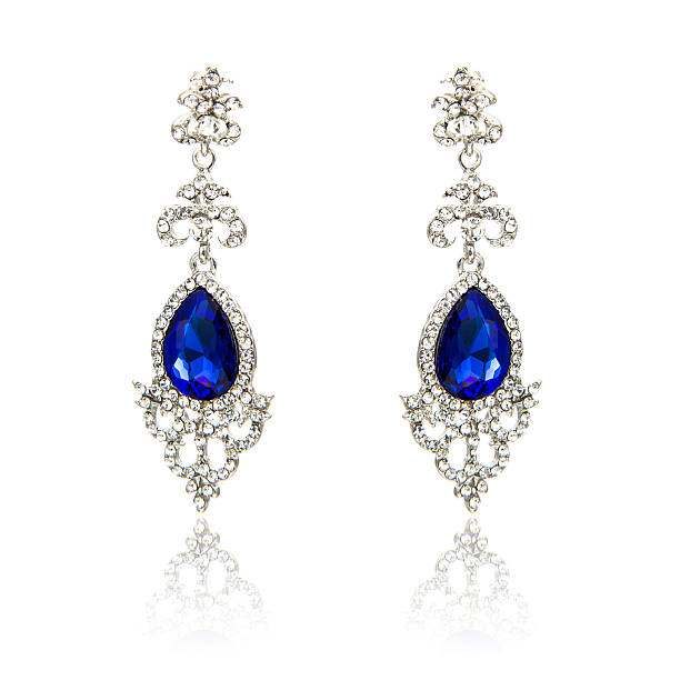 istock Pair of sapphire earrings isolated on white 590042442