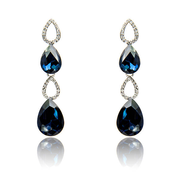 istock Pair of sapphire earrings isolated on white 590042862