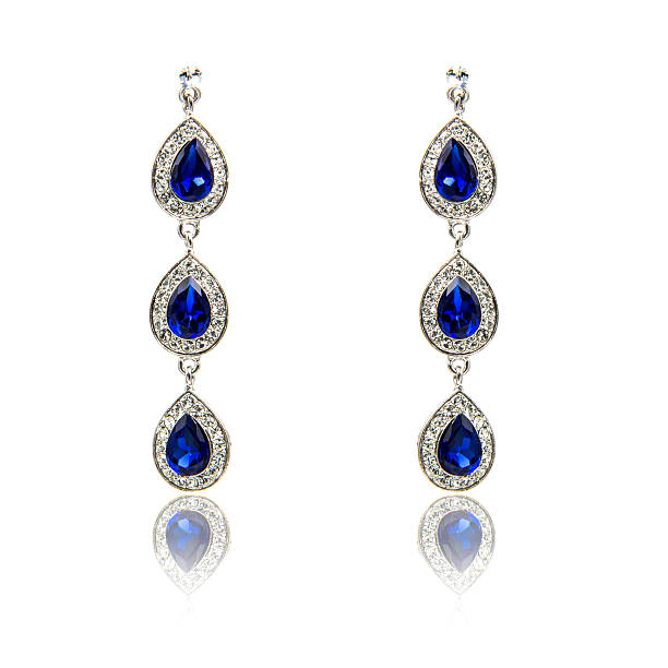 istock Pair of sapphire earrings isolated on white 590043014