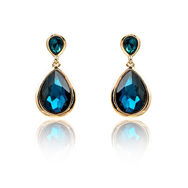 istock Pair of sapphire earrings isolated on white 590043222