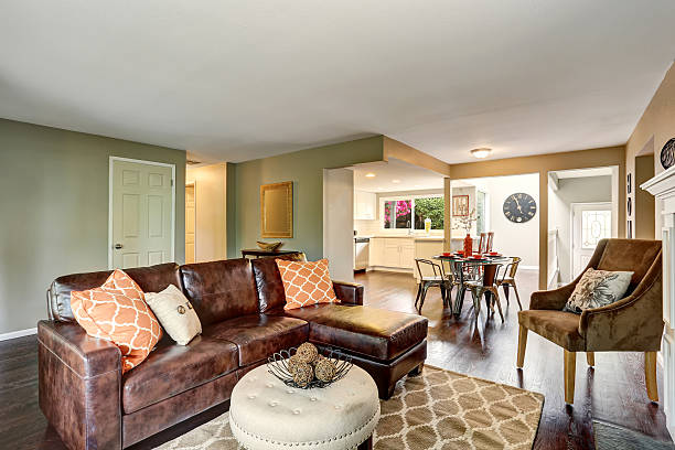 istock Cozy living room with fireplace and leather sofa. 590043422