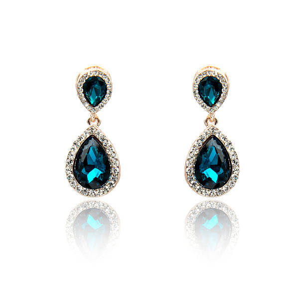 istock Pair of sapphire earrings isolated on white 590043974