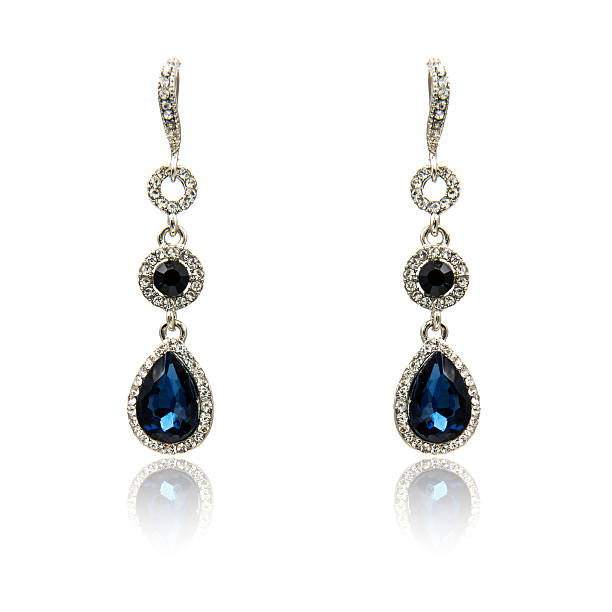 istock Pair of sapphire earrings isolated on white 590044124