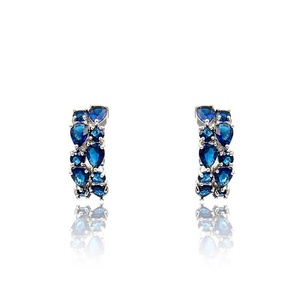 istock Pair of sapphire earrings isolated on white 590044198