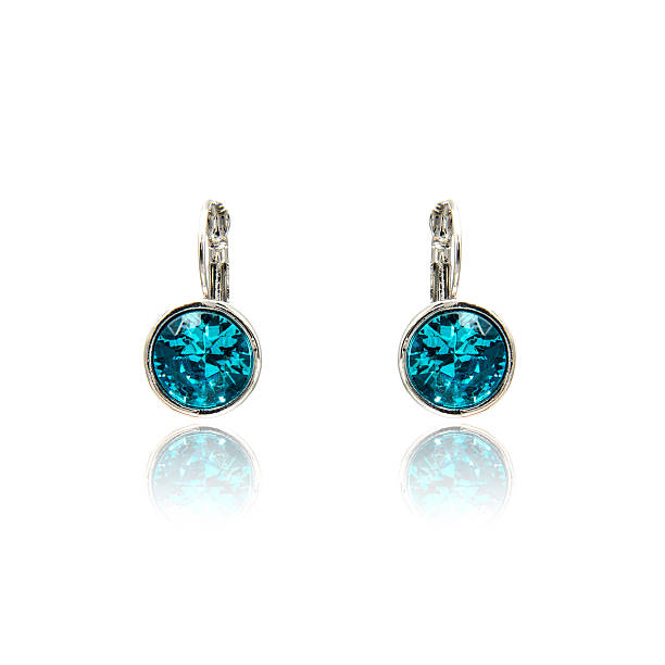 istock Pair of sapphire earrings isolated on white 590044332