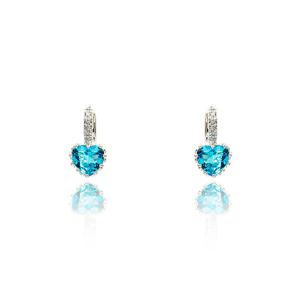 istock Pair of sapphire earrings isolated on white 590044424