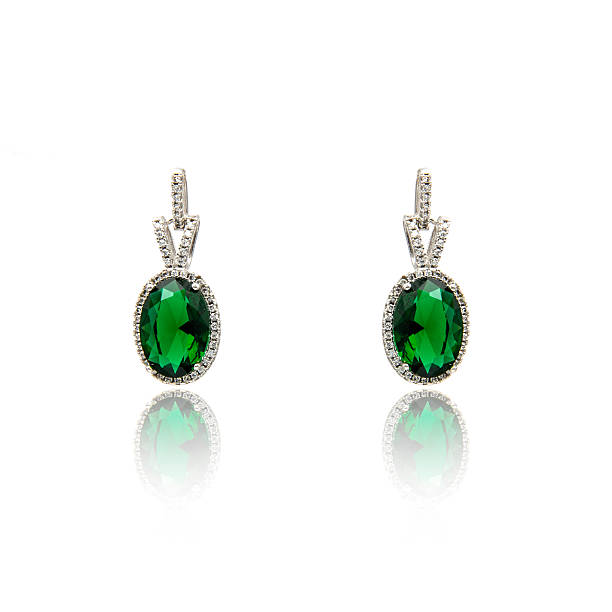 istock Pair of emerald earrings isolated on white 590044482