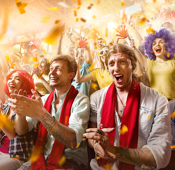 istock Sport fans: Group of cheering fans 590044934