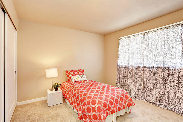 istock Modern teen bedroom interior with red bedding. 590046258